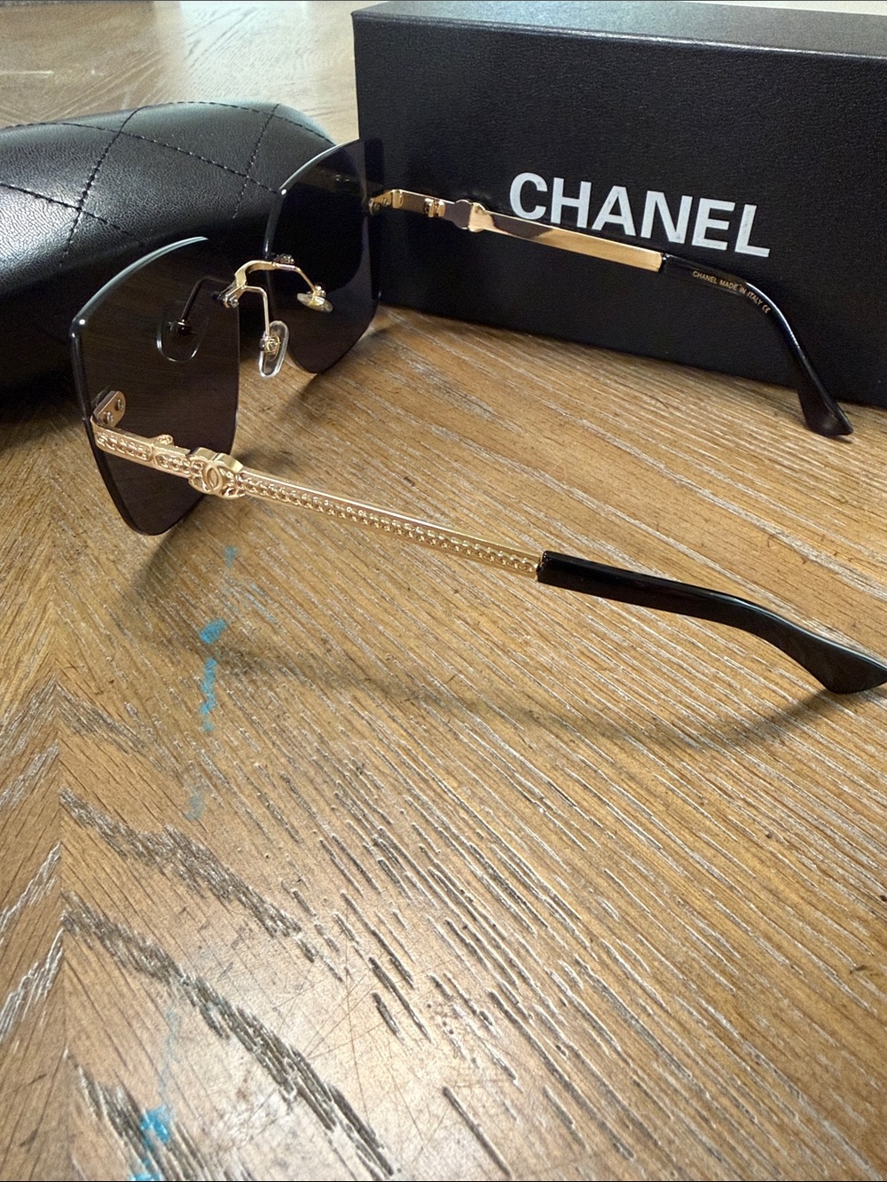 CHANEL Black Rimless Square Sunglasses with Gold Accents - Picture 6 of 9